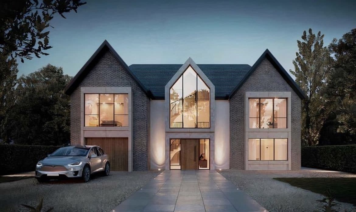 Modern luxury property at dusk with warm interior lighting